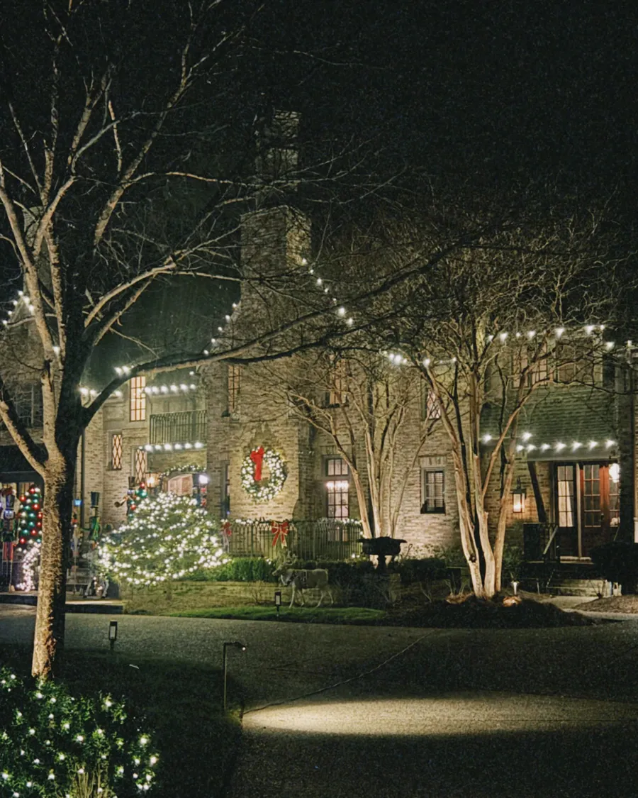A Williamson County home with professionally installed Christmas roofline lighting at night