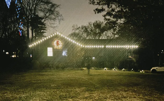 Professional Christmas light installation on a home's gables and entryway, Williamson County, TN