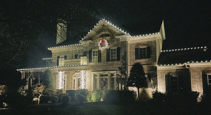 Christmas lights tracing the roofline of a home in Williamson County, TN
