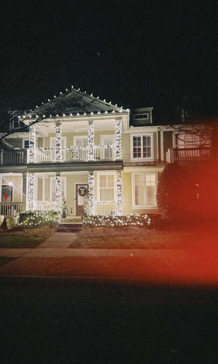 Christmas lights tracing the roofline of a home in Williamson County, TN
