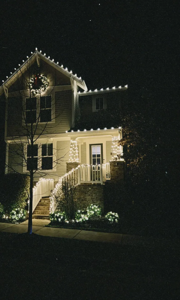 Christmas lights tracing the roofline of a home in Williamson County, TN