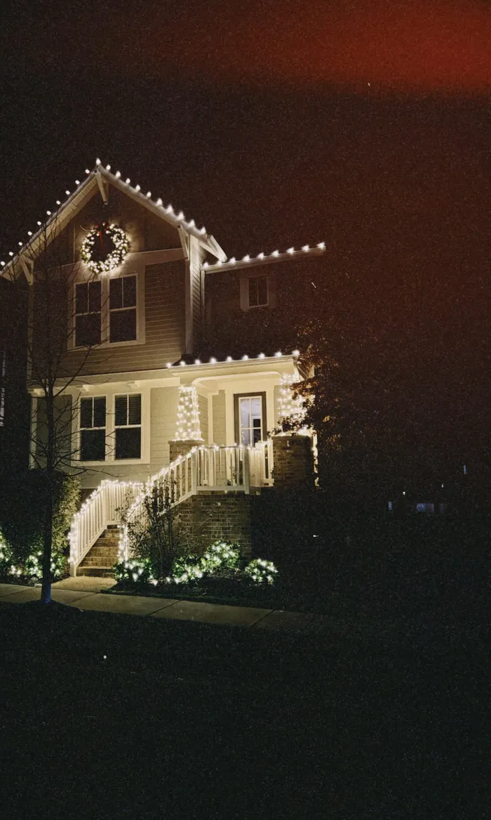 Christmas lights tracing the roofline of a home in Williamson County, TN