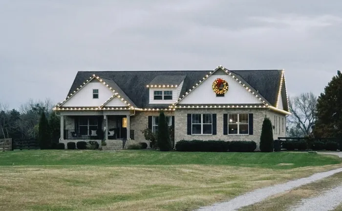 Christmas lights tracing the roofline of a home in Williamson County, TN