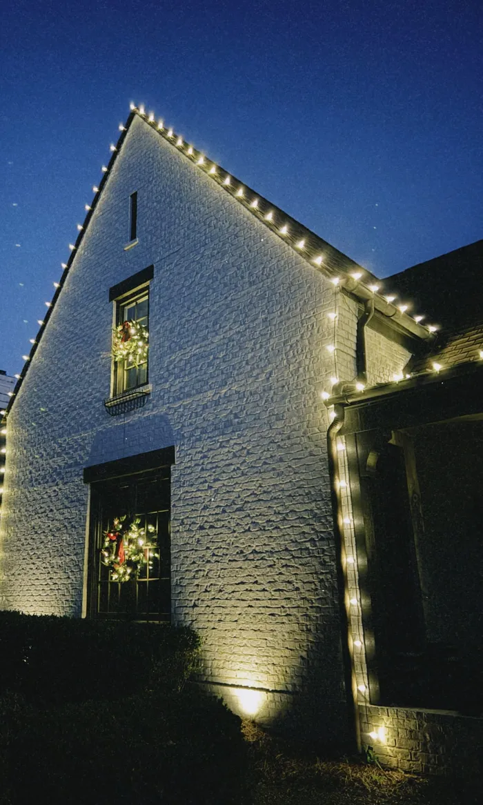 Christmas lights tracing the roofline of a home in Williamson County, TN