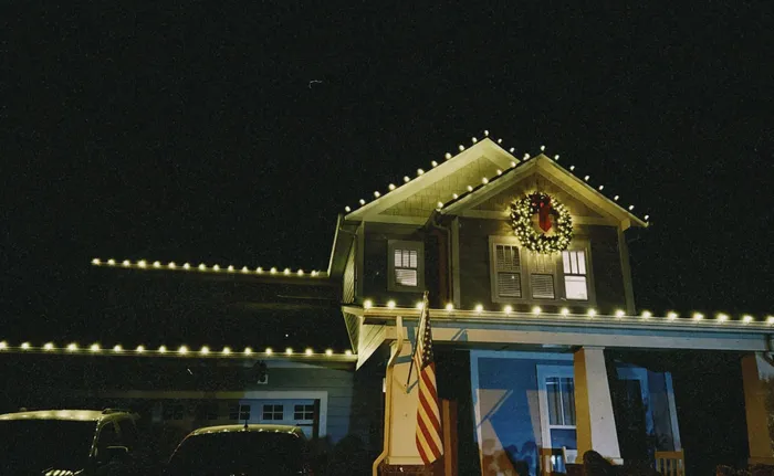 Professional Christmas light installation on a home's gables and entryway, Williamson County, TN