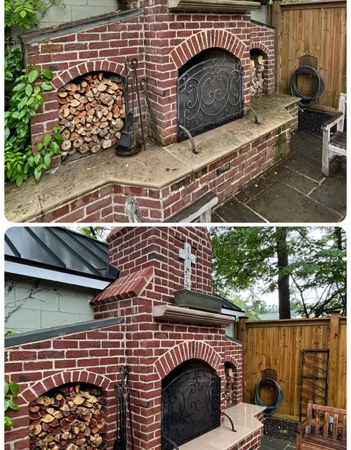 Custom dry-stack stone outdoor fireplace and patio wall