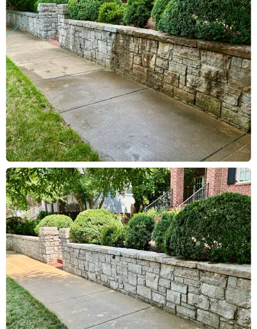 Stone wall along a cleaned driveway